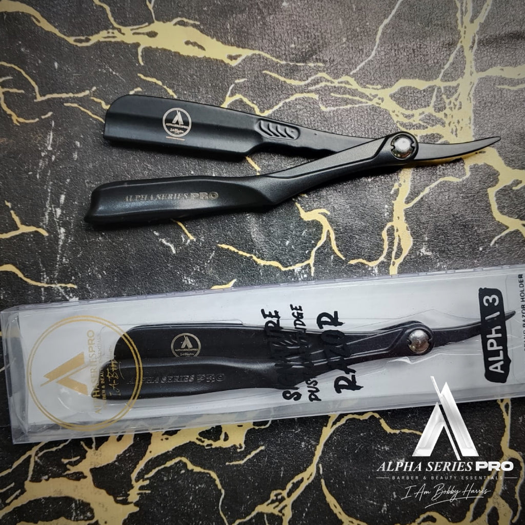 ALPHA 3 black razor with front of signature packaging