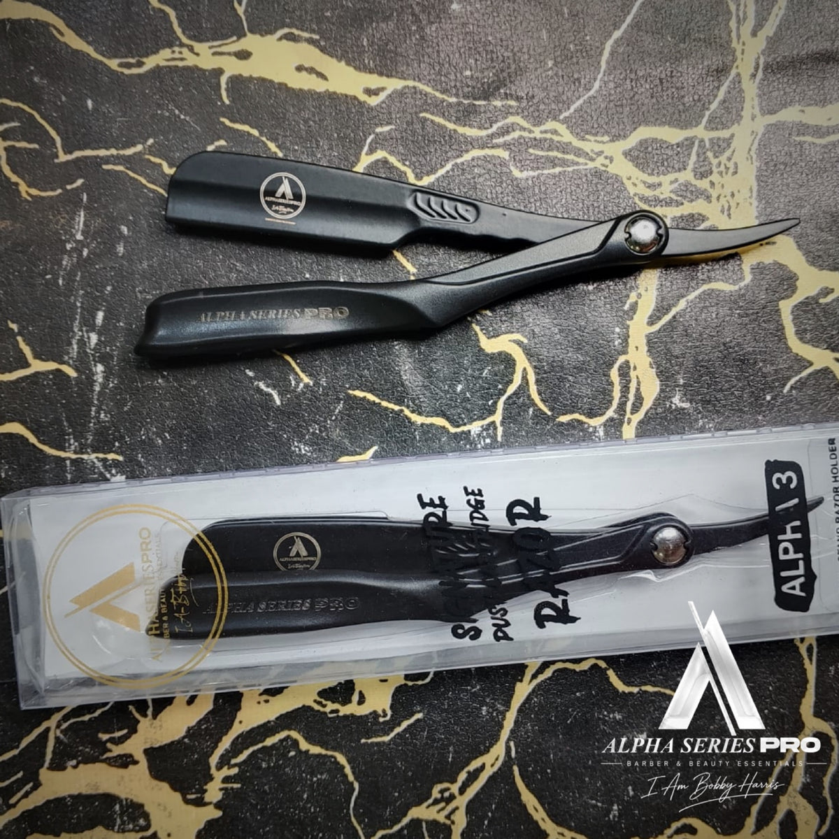 ALPHA 3 black razor with front of signature packaging